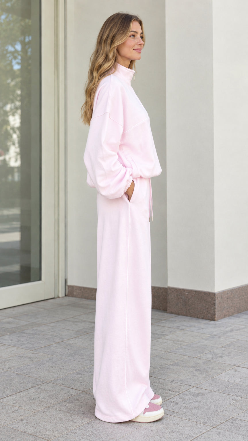 Side view of woman in Light Pink two-piece fleece loungewear set