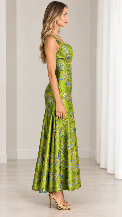 Side profile view of model in lime green botanical print maxi dress