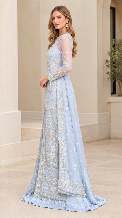 Side profile of model in a sky blue floor-length embroidered gala gown