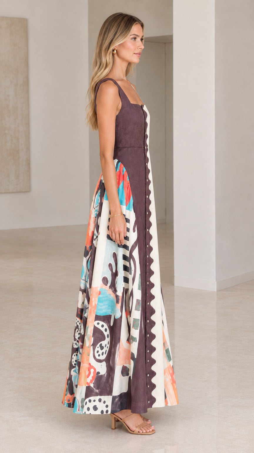 Side profile of model in chocolate brown scalloped colorblock maxi dress with colorful printed panels