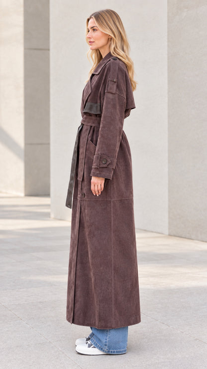 Side profile view of model wearing brown full-length suede duster coat