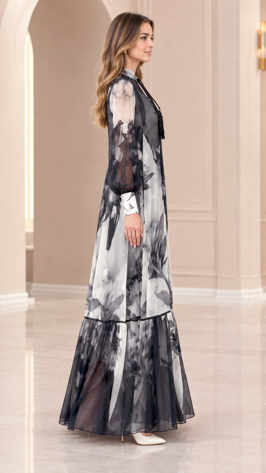 Side view of black and white floral long sleeve maxi dress