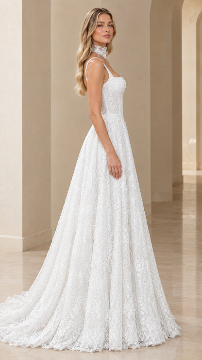Side profile of white textured lace A-line formal gown