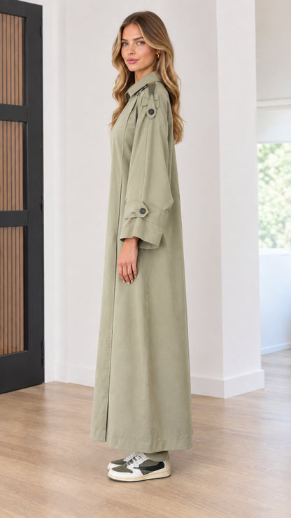 Side profile view of relaxed long sleeve trench maxi dress in sage green