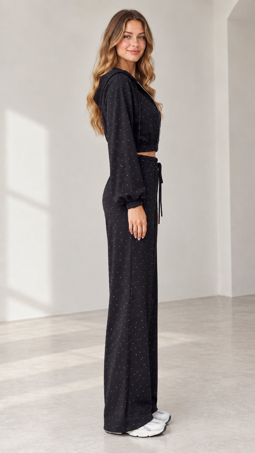 Side profile view of model wearing black sparkle 3-piece lounge set