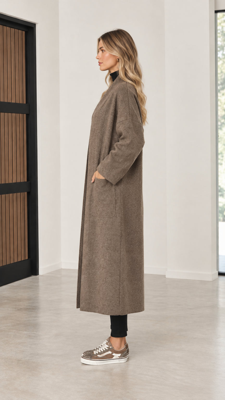 Side profile of model wearing mocha maxi duster coatigan