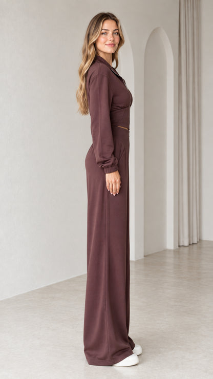 Side full-length view of woman wearing chocolate brown two-piece matching lounge set