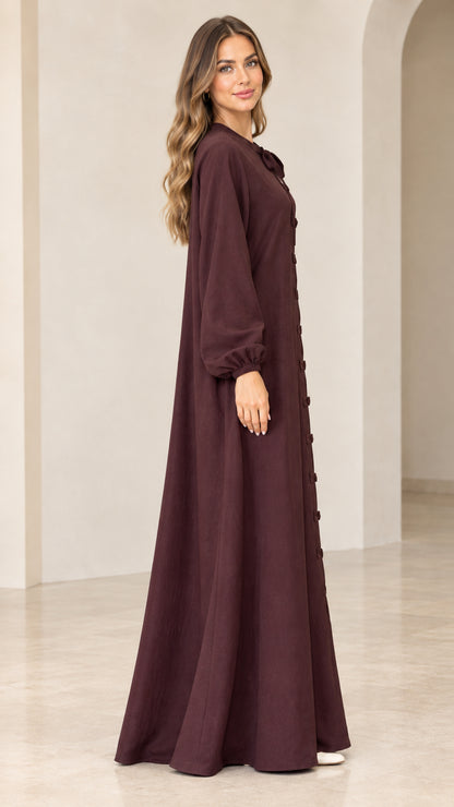 Burgundy long sleeve maxi dress side view showing loose drape