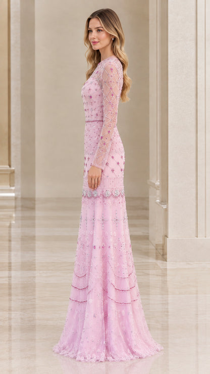 Side profile view of woman wearing blush pink embellished floor-length maxi dress