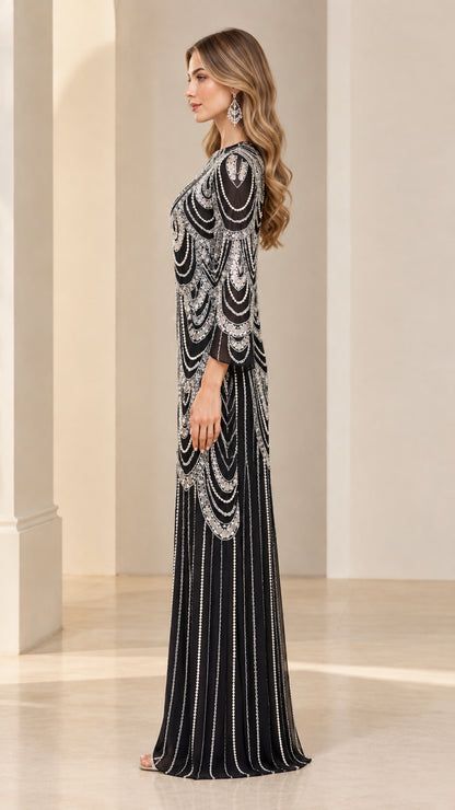 Side profile view of black beaded maxi gown showcasing flared sleeves and column drape