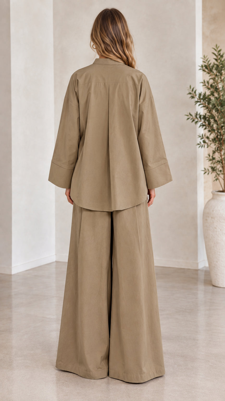 Back view of woman showcasing relaxed khaki wide-leg matching pants set