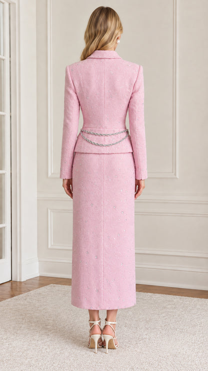 Back full-length view of tailored pink tweed jacket and long skirt set