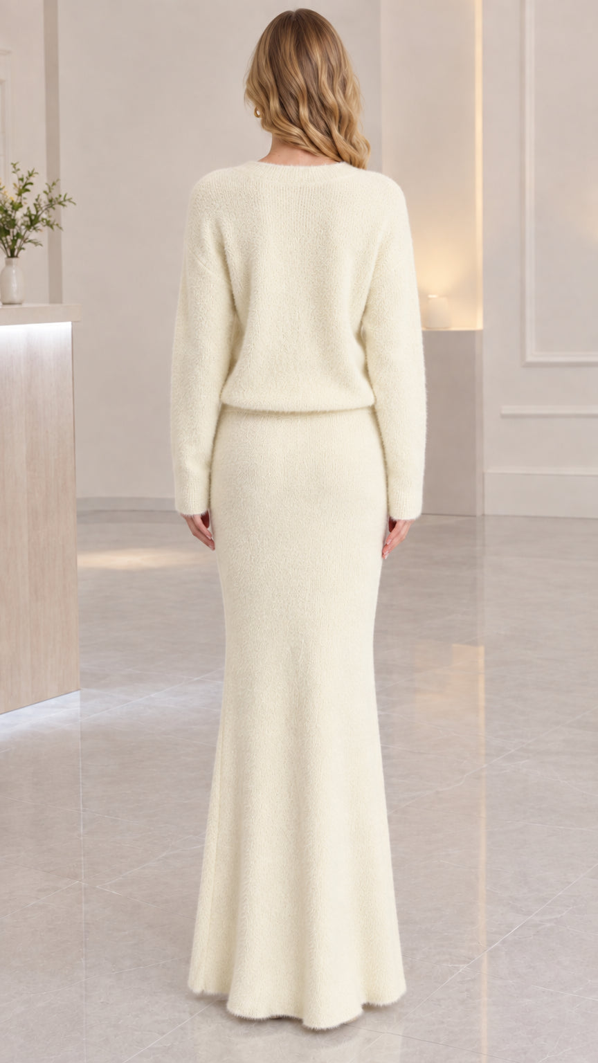 Back view of model wearing cream fuzzy knit matching two-piece set