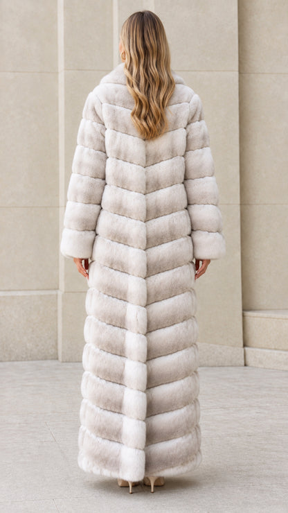 Back view of model showing chevron seam construction on Light Gray maxi fur coat
