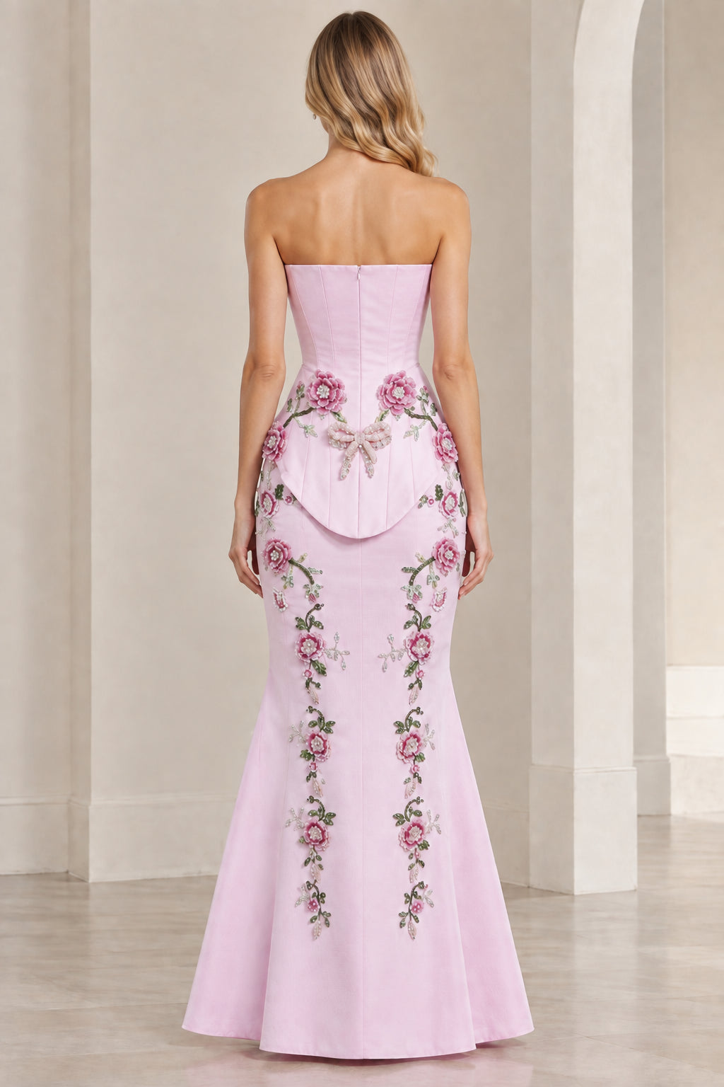 Back view of Light Pink strapless mermaid maxi dress showing trailing floral embroidery