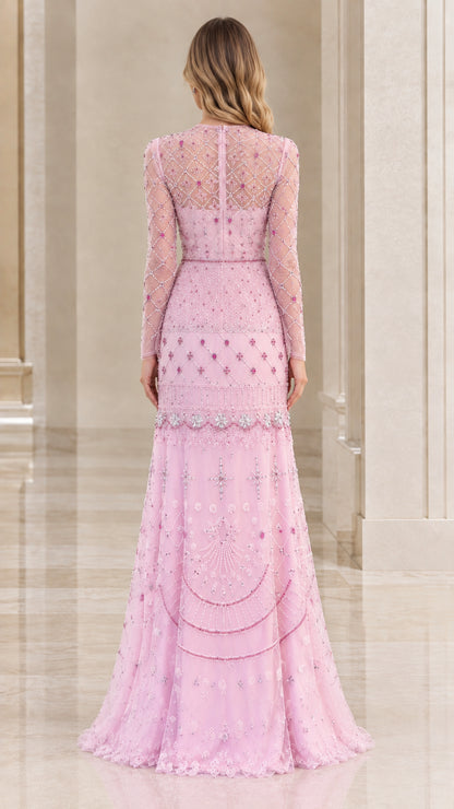 Back view of blush pink long-sleeve beaded evening gown