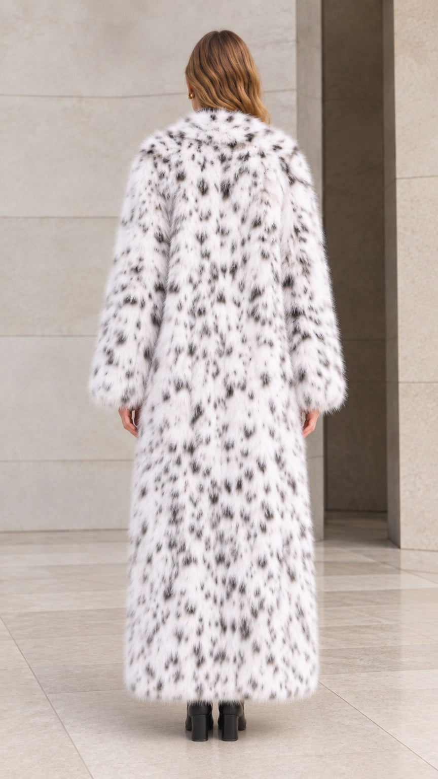 Back view of woman wearing floor-length white speckled plush faux fur coat