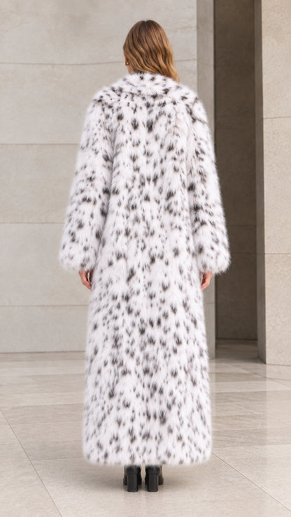 Back view of woman wearing floor-length white speckled plush faux fur coat
