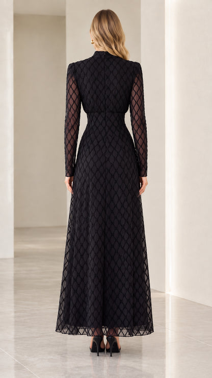 Back view of woman wearing black long sleeve high neck maxi evening dress