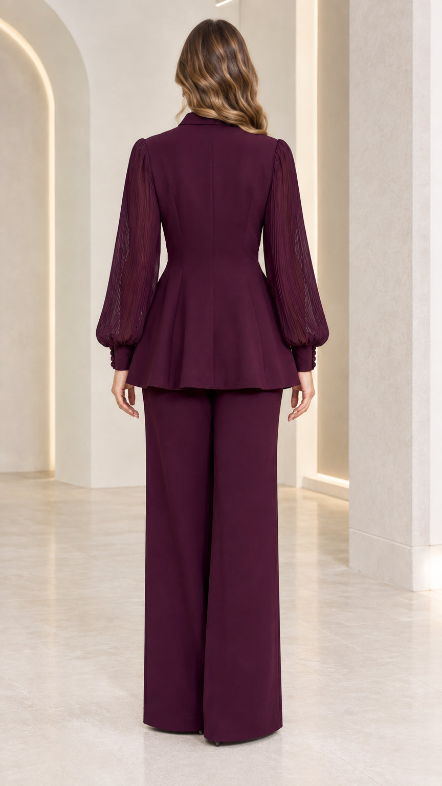 Back view of burgundy formal peplum top and floor-length trousers