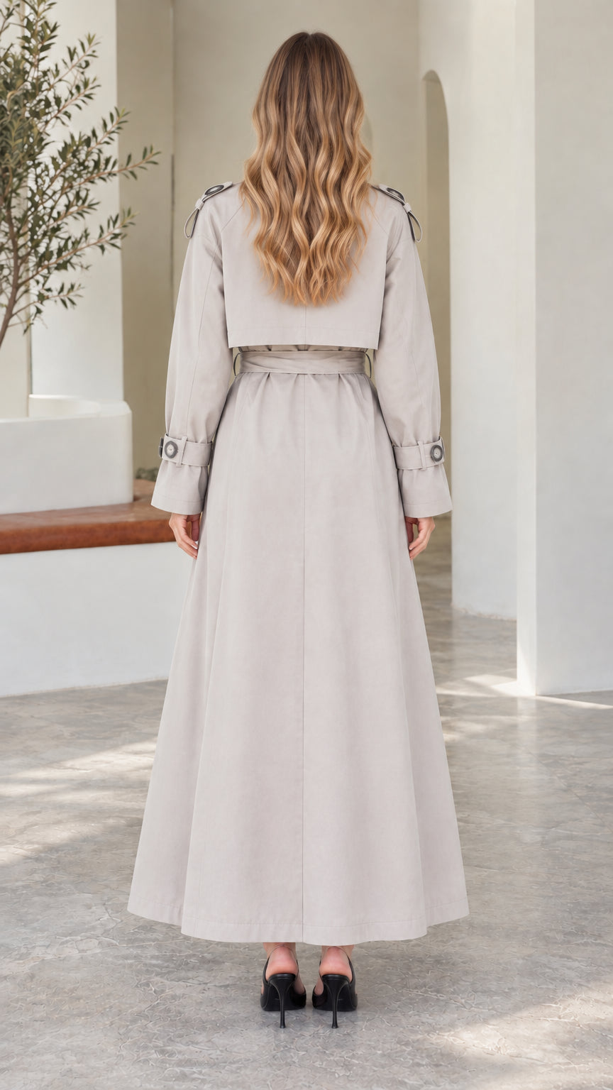 Back view of model in Light Grey longline trench coat showing storm flap overlay