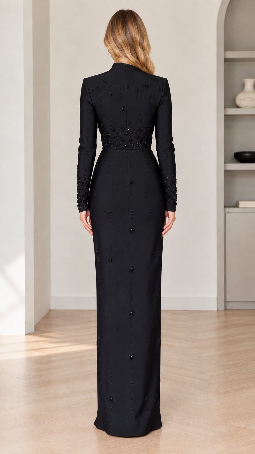 Back view of model in elegant black floor-length formal dress