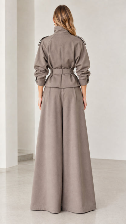 Back view of taupe two-piece pant suit with defined belted waist