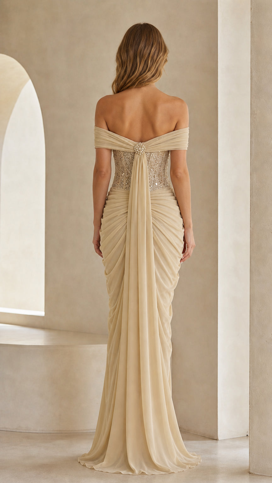 Back view of champagne evening gown showing draped back detail