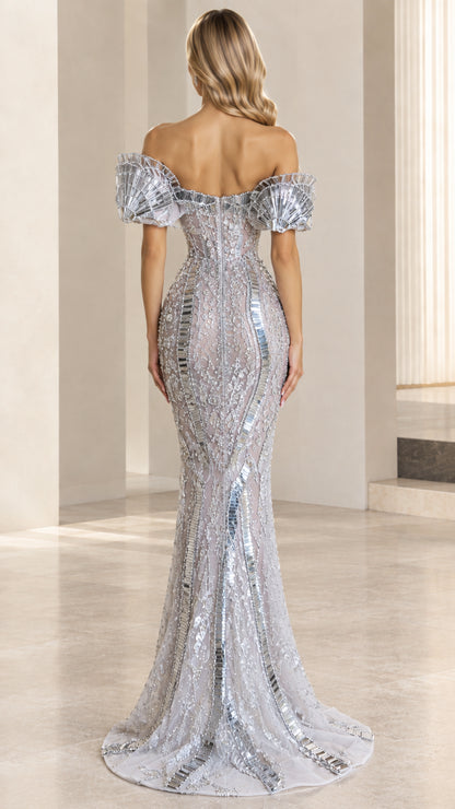 Back view of model in silver sequin off-the-shoulder evening gown