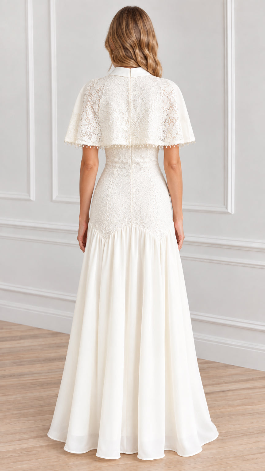 Back view of woman in white lace maxi dress with capelet and back zipper