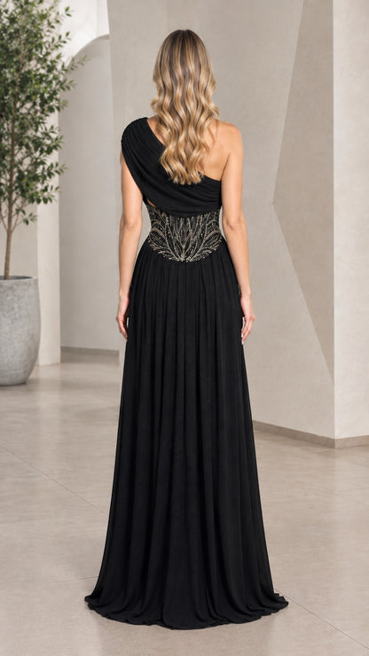 Back view of model in black draped one-shoulder formal evening dress