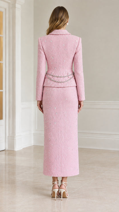 Back view of pink tailored tweed jacket and maxi skirt set