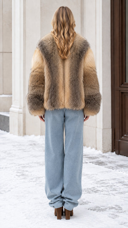 Back view of model wearing a two-tone brown faux fur coat outdoors