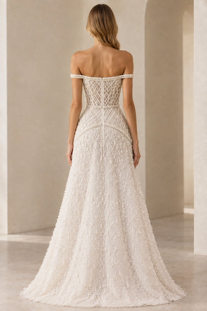 Back view of ivory beaded formal gown showing off-shoulder cut and structured back