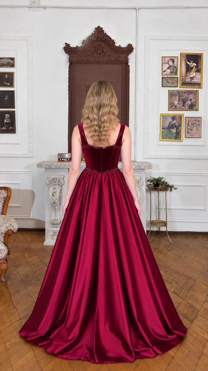 Back view of model showcasing square back and full skirt in burgundy