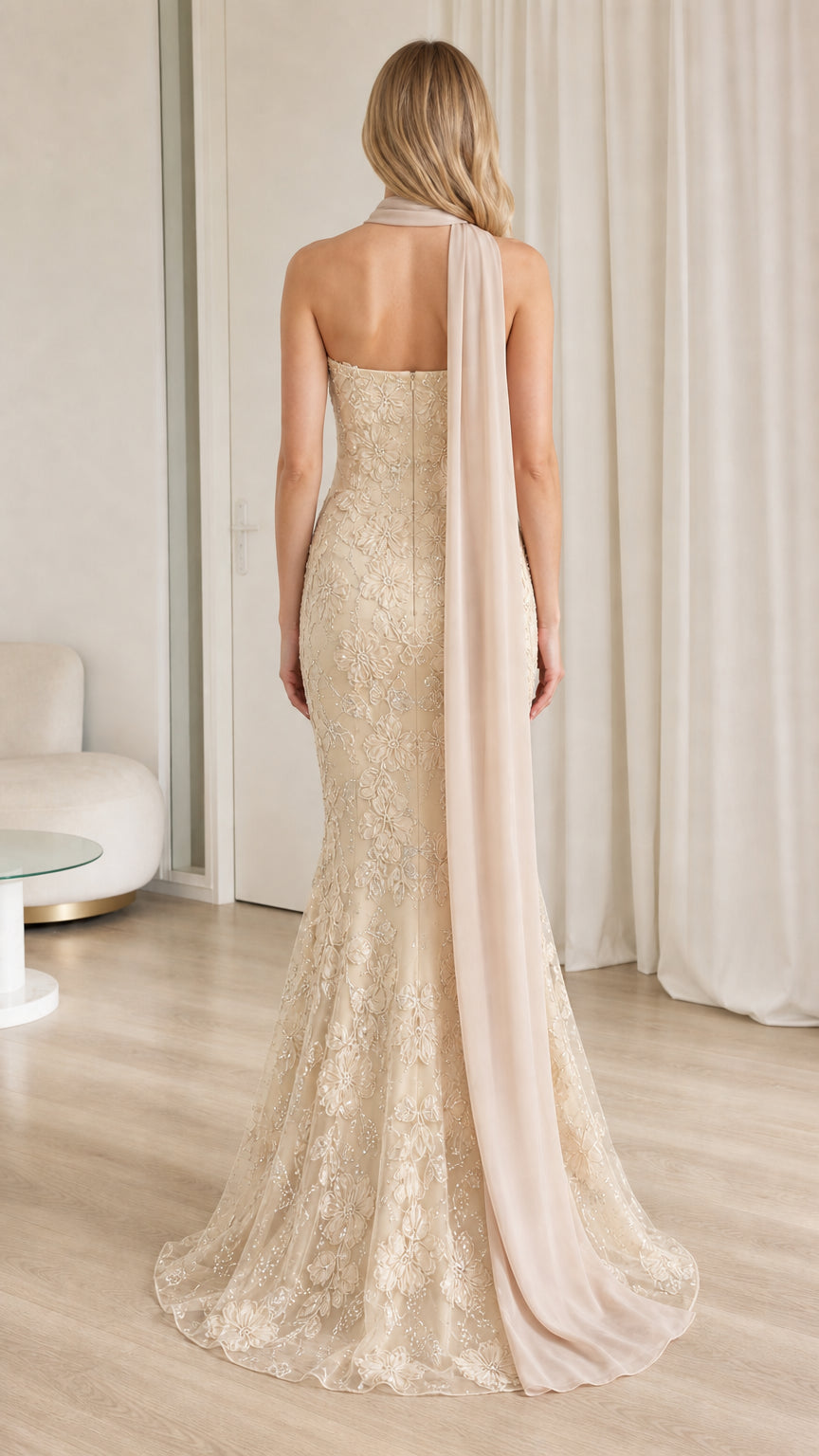 Back view of champagne lace mermaid formal dress with elegant trailing drape