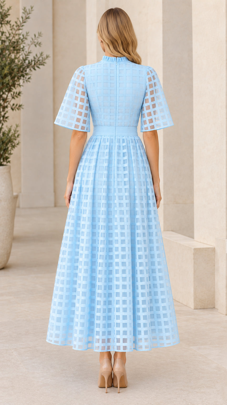 Back view of light blue mock neck maxi dress showing invisible zipper and full skirt