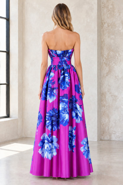Back view of model wearing magenta strapless floral evening dress