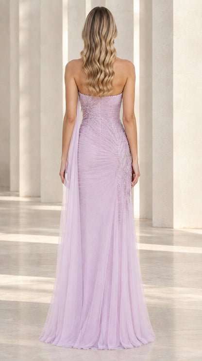Back view of lavender strapless tulle gown showing flowing cape train