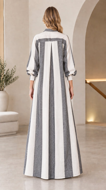 Back view of charcoal grey vertical striped maxi duster coat showing inverted box pleat