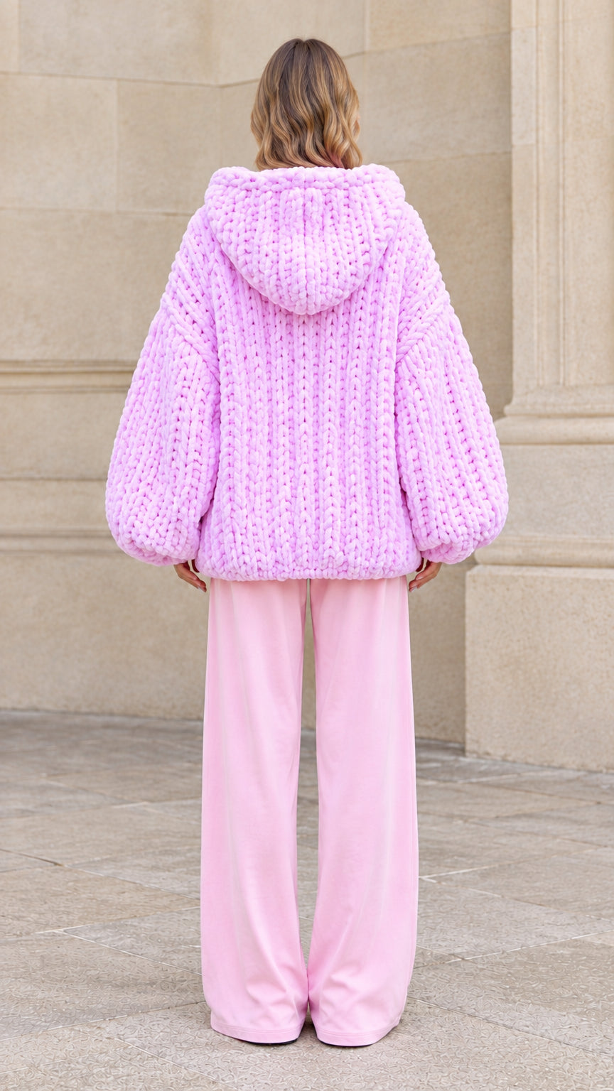 Back view of pink oversized chunky knit hooded sweater coat