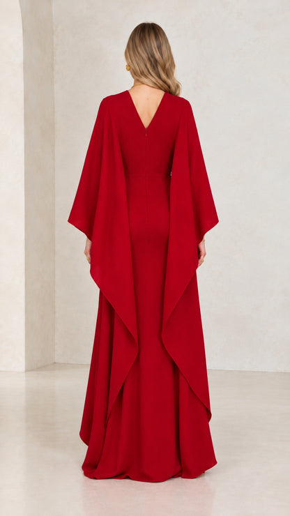 Back view of red V-back cape sleeve mermaid maxi gown