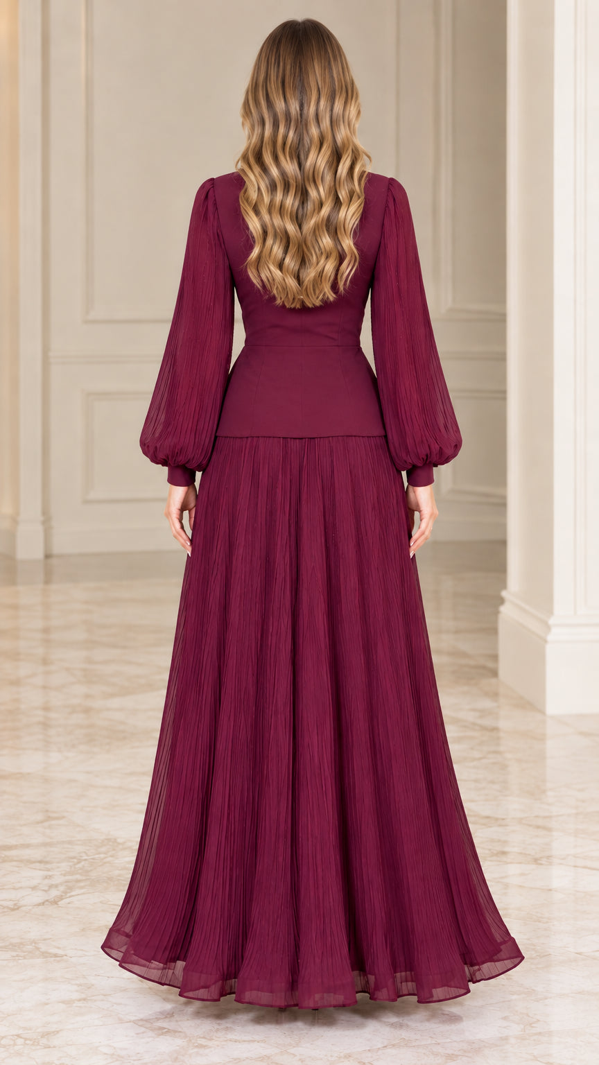 Back view of burgundy pleated formal maxi dress showing tailored waist