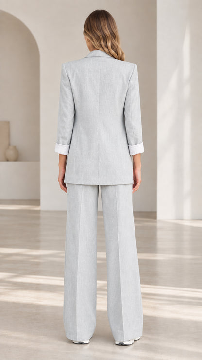 Back view of woman wearing Light Grey two-piece tailored pant suit