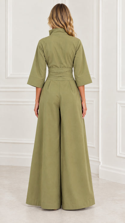 Back view of woman wearing an olive green wide-leg jumpsuit