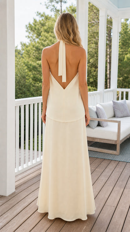 Back view of ivory backless halter tie top and floor length skirt