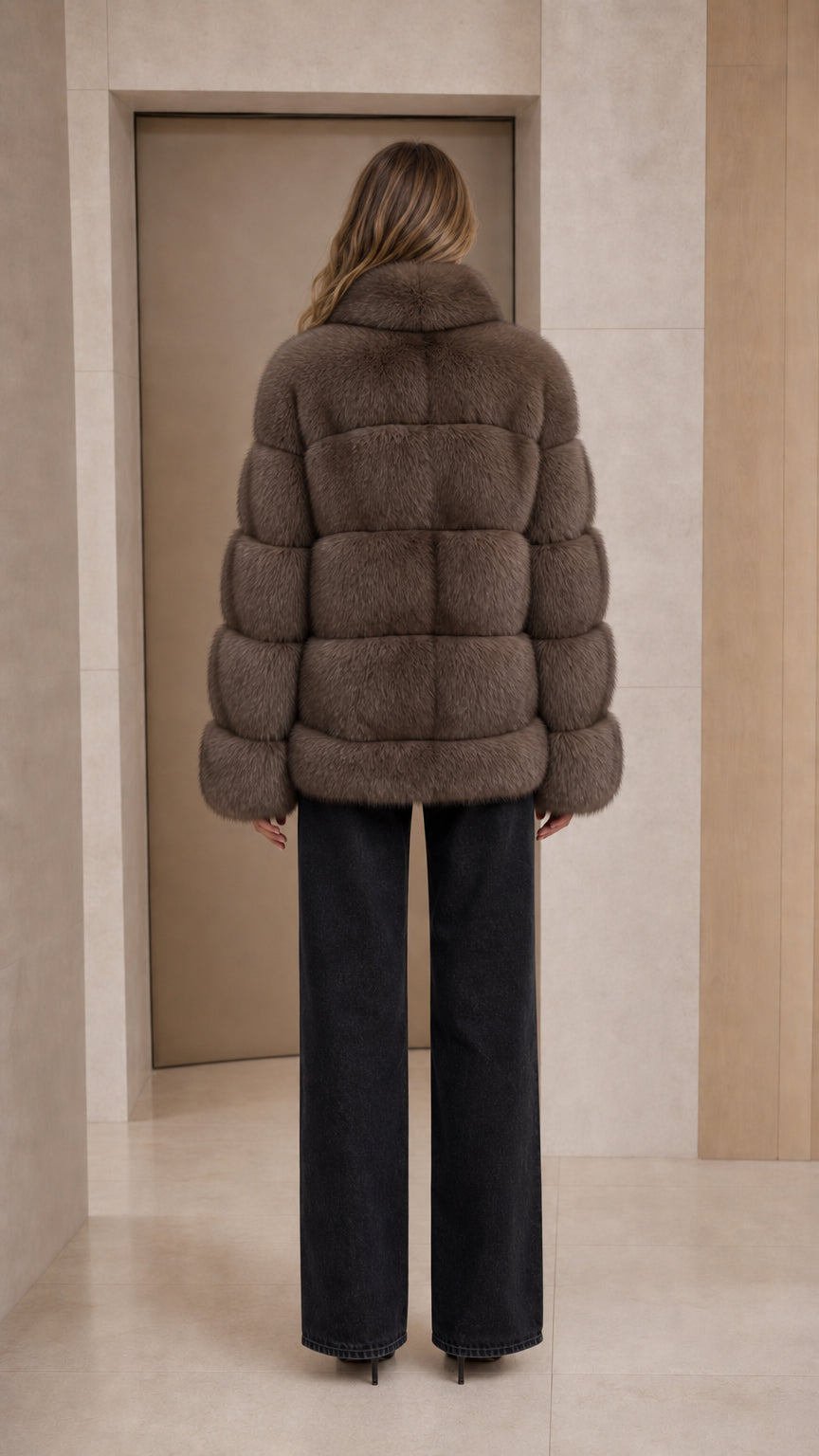 Back view of taupe horizontal paneled faux fur winter jacket