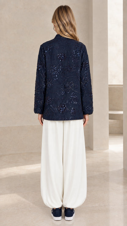 Back view of navy blue floral sequin embellished jacket top