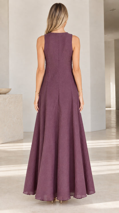 Back view of woman wearing Plum textured sleeveless maxi dress
