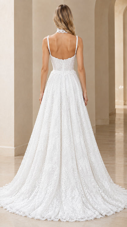 Back view of white lace gown showing low back cut and train